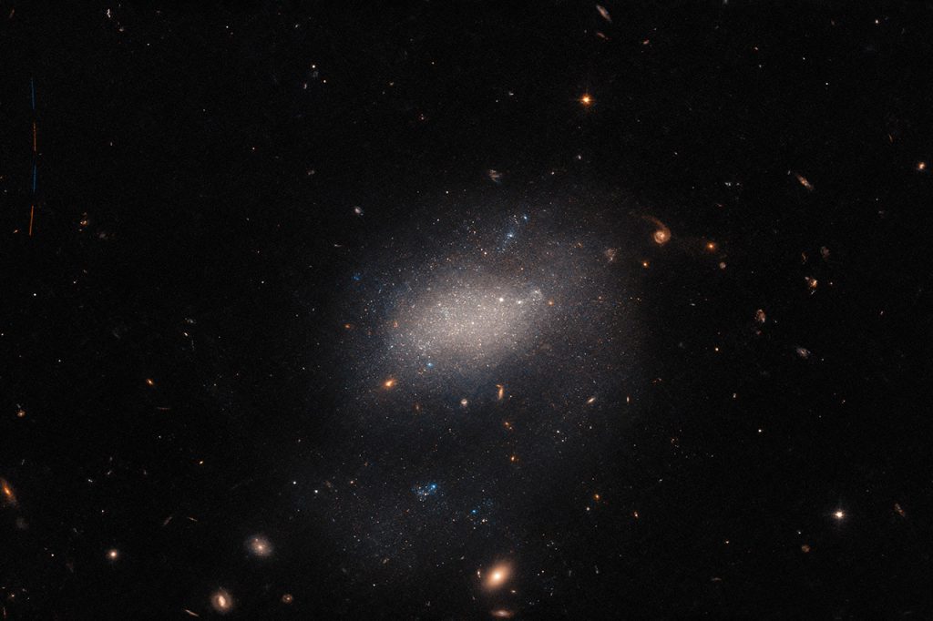 hubble-space-telescope-galaxy-ugc-7983-asteroid.jpg